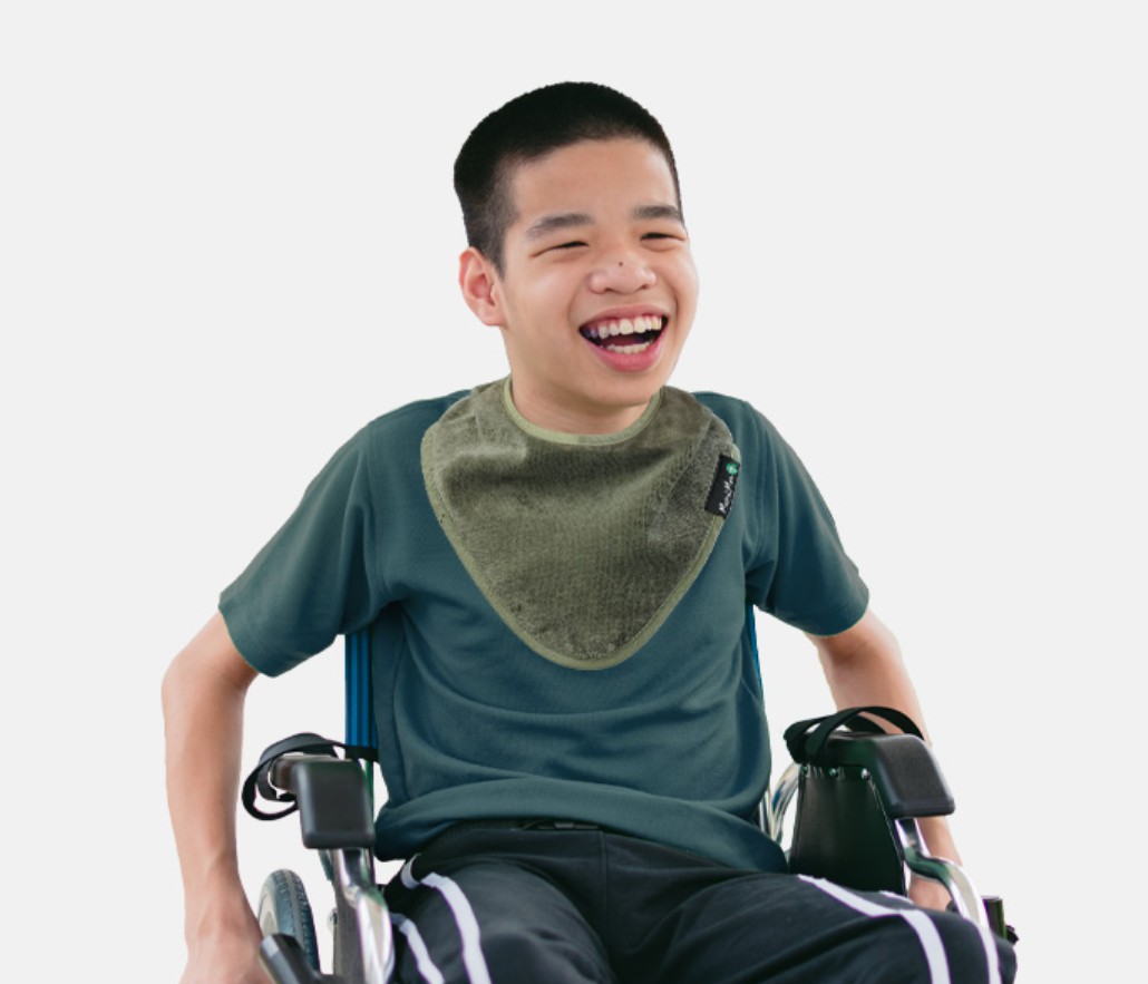 Youth Bandana Bib in khaki kid wearing a bandana bib.