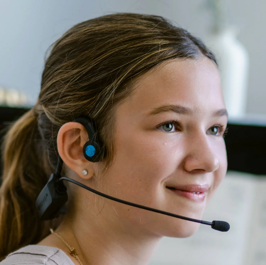 Child using the Forbrain bone conduction headset – supports learning, speech fluency, and sensory processing through vibration technology; potentially NDIS-funded