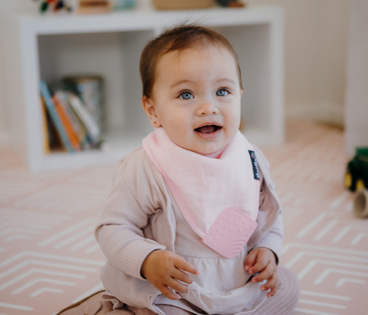 baby using Teething Bib - Baby Pink