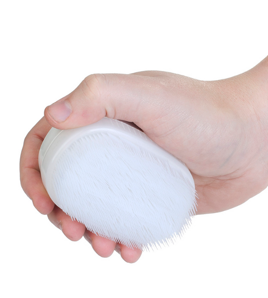 Hand holding Wilbarger sensory brush – ideal for therapist-guided brushing protocol to support regulation in children, may be eligible for NDIS funding