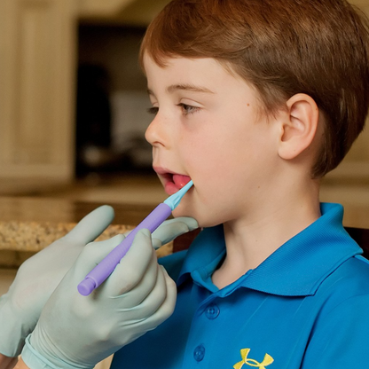 Therapist using ARK Fine Tip Z-Vibe attachment with child during oral motor session – suitable for NDIS funding.