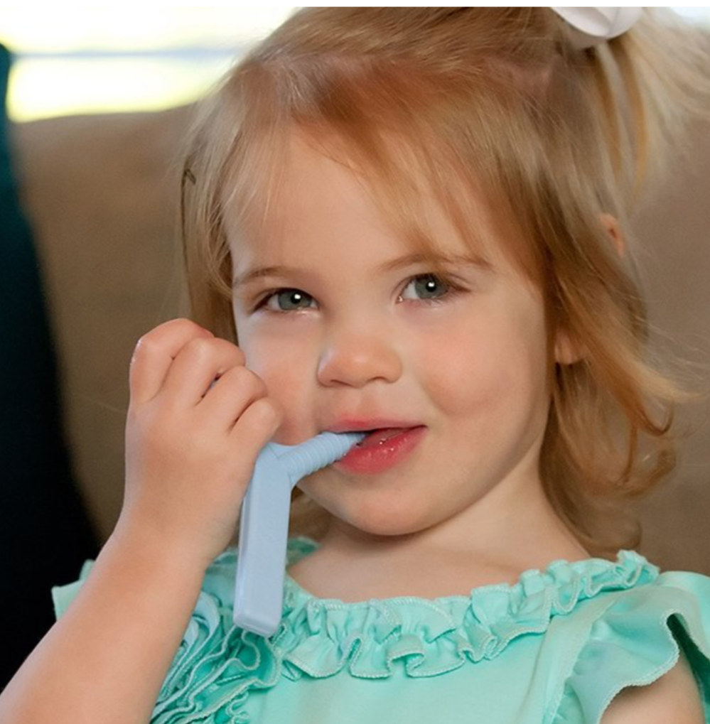Child using light blue ARK Y-Chew for sensory regulation – suitable for NDIS therapeutic use