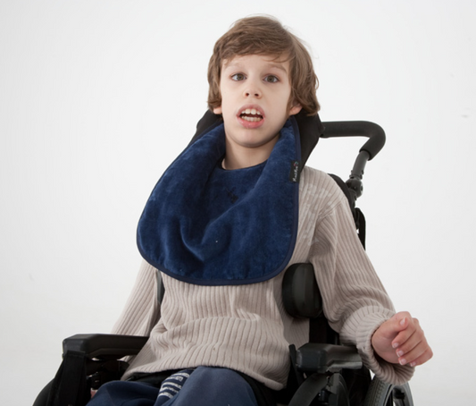 child wearing Standard Back Opening Feeding Apron in navy colour.